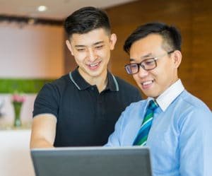 Two men discussing corporate finance solutions