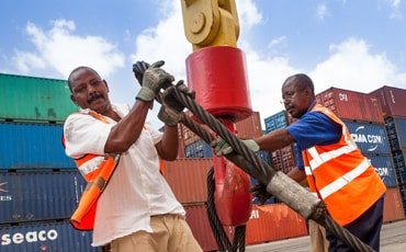 Two men working in port