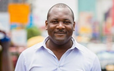 Smiling man in street scene