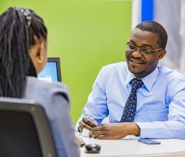 Staff discussing business expansion with client