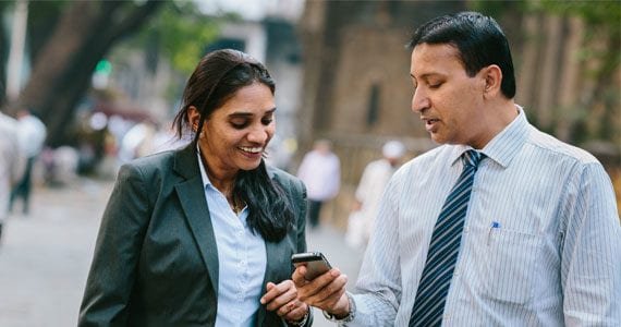 Couple using Straight2Bank wallet