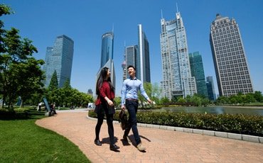 Couple walking through a park