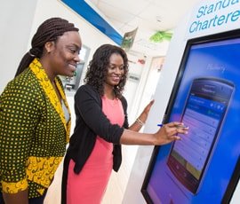 Customer in branch using innovative banking