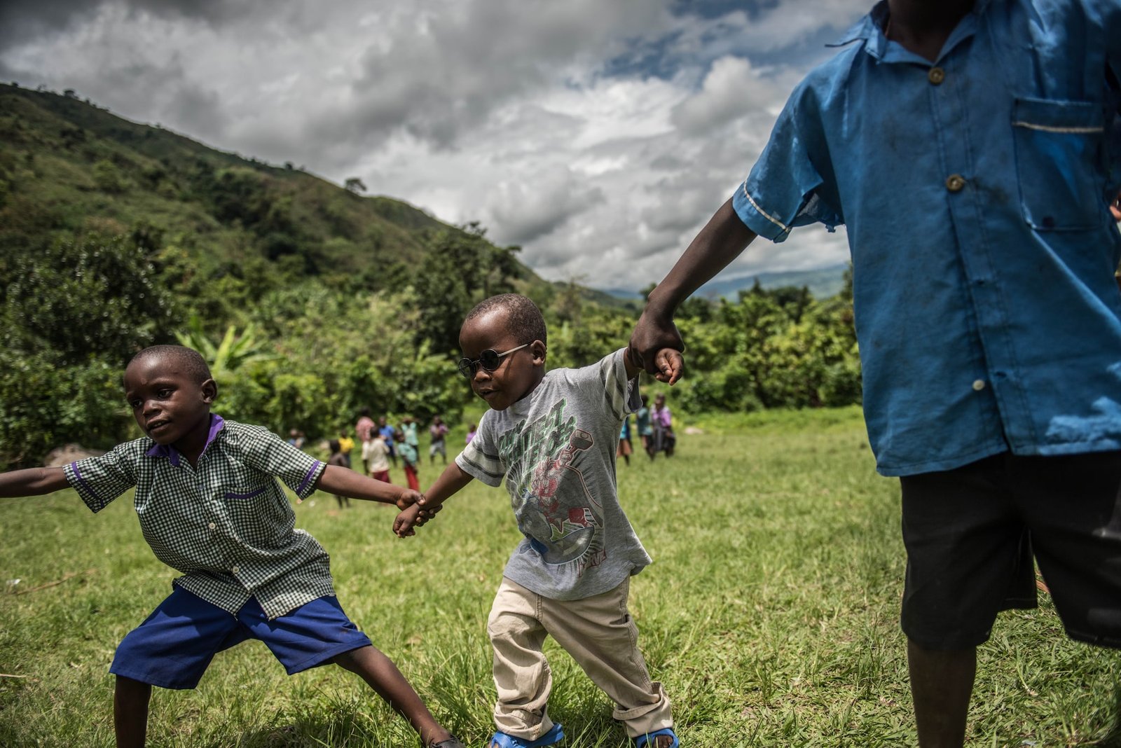 The students and Criscent form a circle and dance around whilst singing